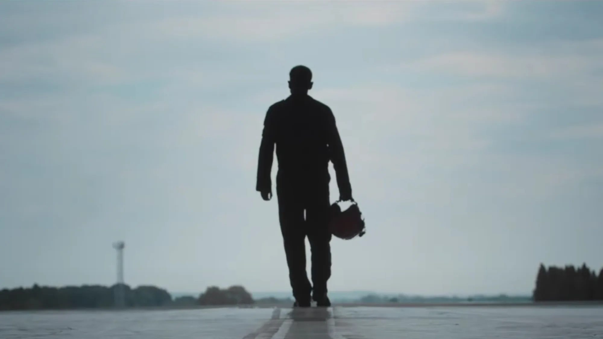 Emission Impossible documentary poster: a silhouetted figure against a dramatic sky