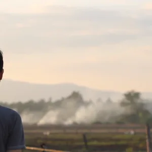 A man stares into the distance