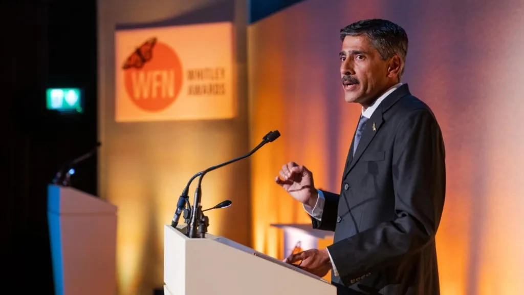 A speaker at the podium at the Whitley Awards event filmed at the RGS in London. Floating Harbour also live streamed the event.