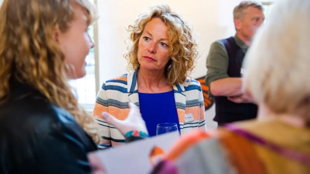 Wildlife presenter and WFN Ambassador Kate Humble engages in conversation during the pre-ceremony reception at the Whitley Awards, providing context for live stream production in London.