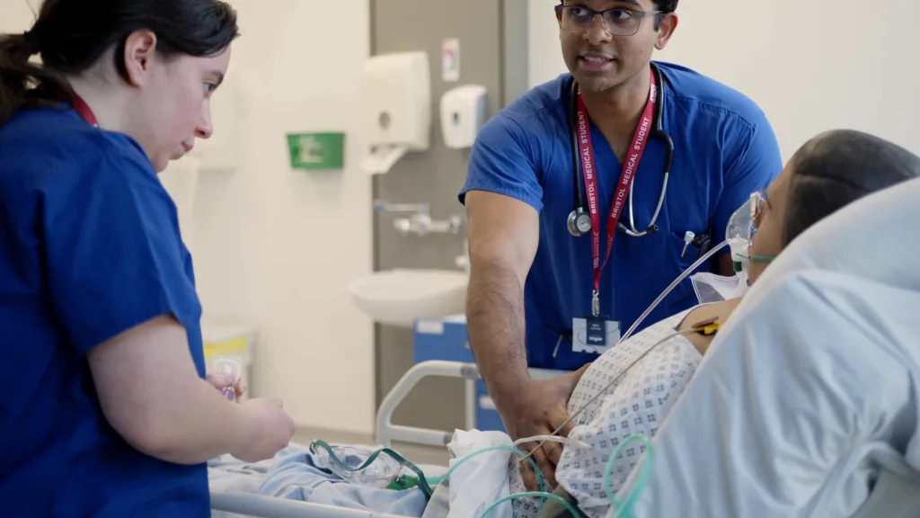 University of Bristol medical students working with a simulated patient during a clinical training exercise, filmed by Floating Harbour for a recruitment film showcasing student life and learning.