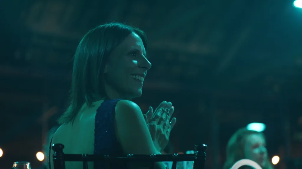 A guest smiling and applauding during a London corporate awards evening, filmed by Floating Harbour as part of an event highlights film.