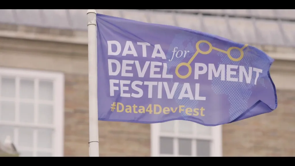 Flag displaying the Data for Development Festival at a United Nations event in Bristol, filmed by Floating Harbour as part of their event and documentary video production work.