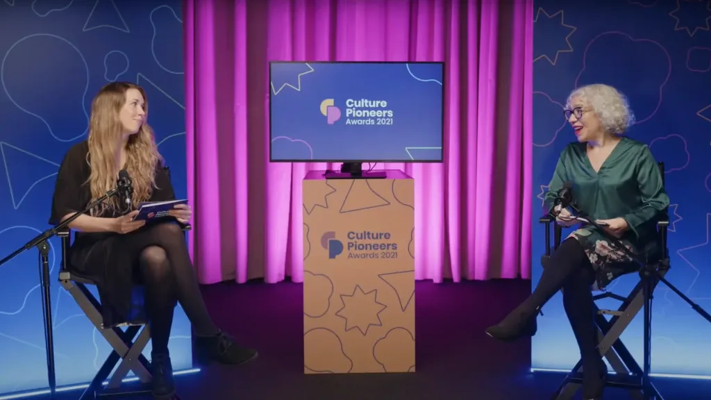 Two presenters on a studio set during the Culture Pioneers Awards 2021 livestream.