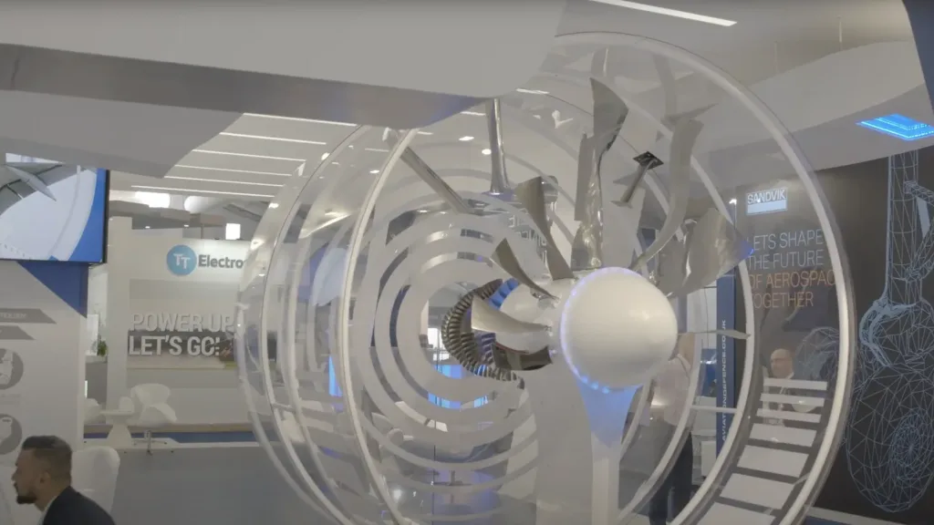 Large turbine style display with spinning blades on an aerospace exhibition stand