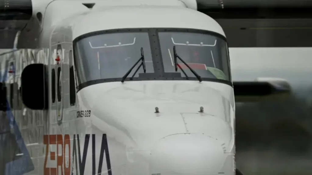ZeroAvia Dornier 228 hydrogen-electric aircraft taxiing with pilots visible through the cockpit window, filmed by Floating Harbour.