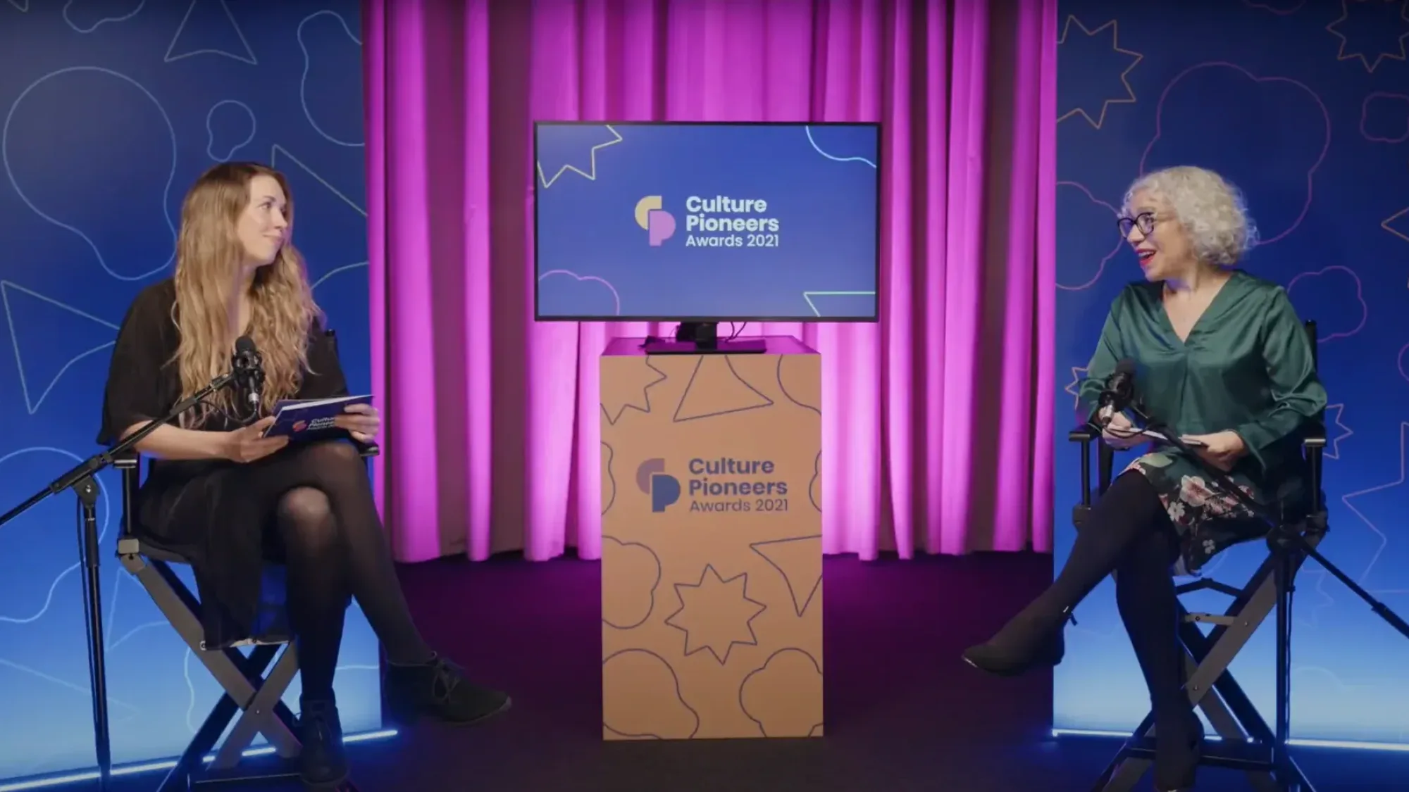 Two presenters on a studio set during the Culture Pioneers Awards 2021 livestream.