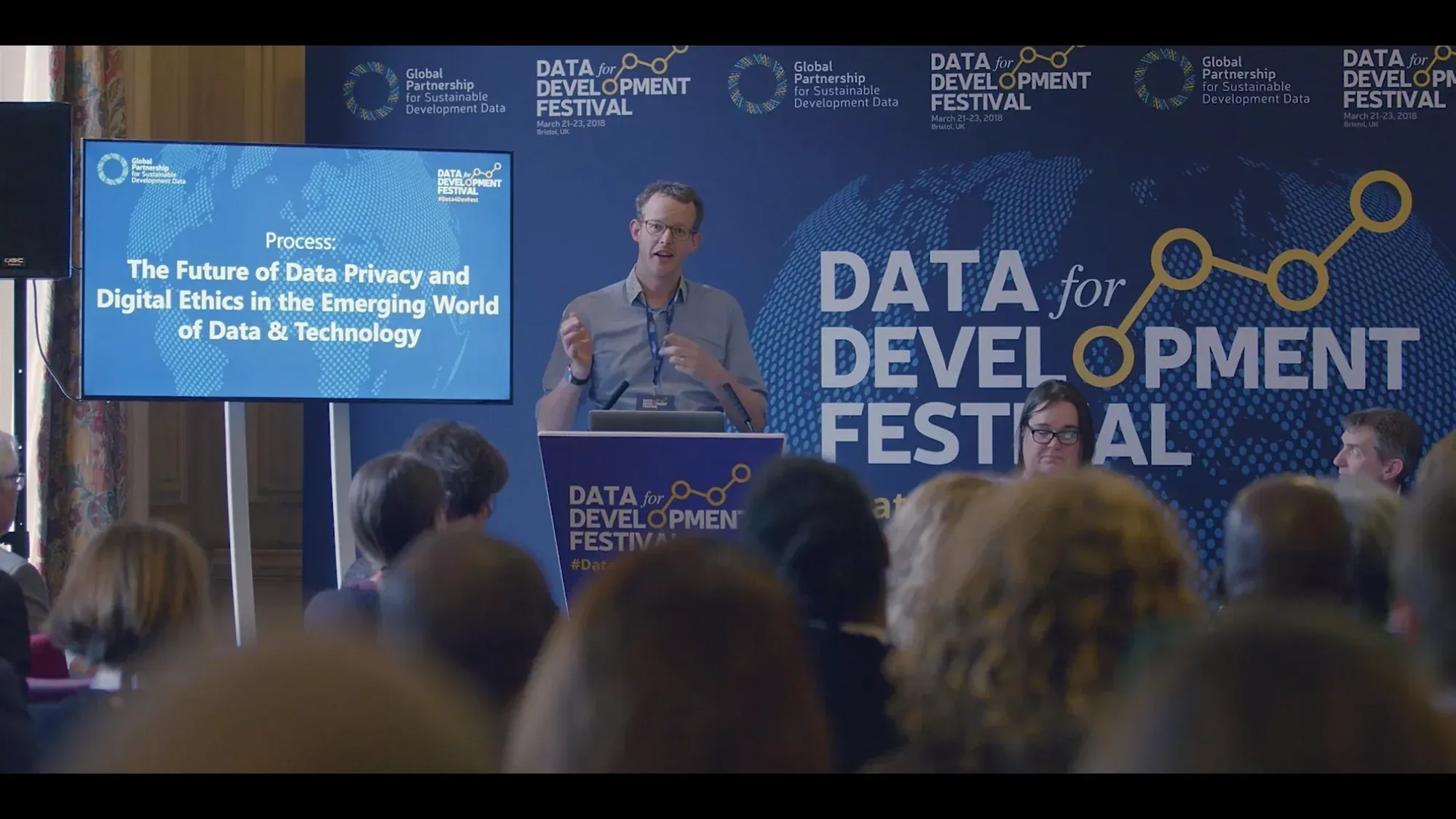 Speaker presenting at the Data for Development Festival in Bristol, filmed by Floating Harbour.
