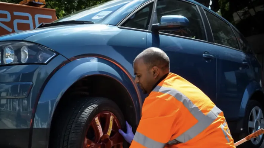 A mechanic changes a tyre in one of our transport films