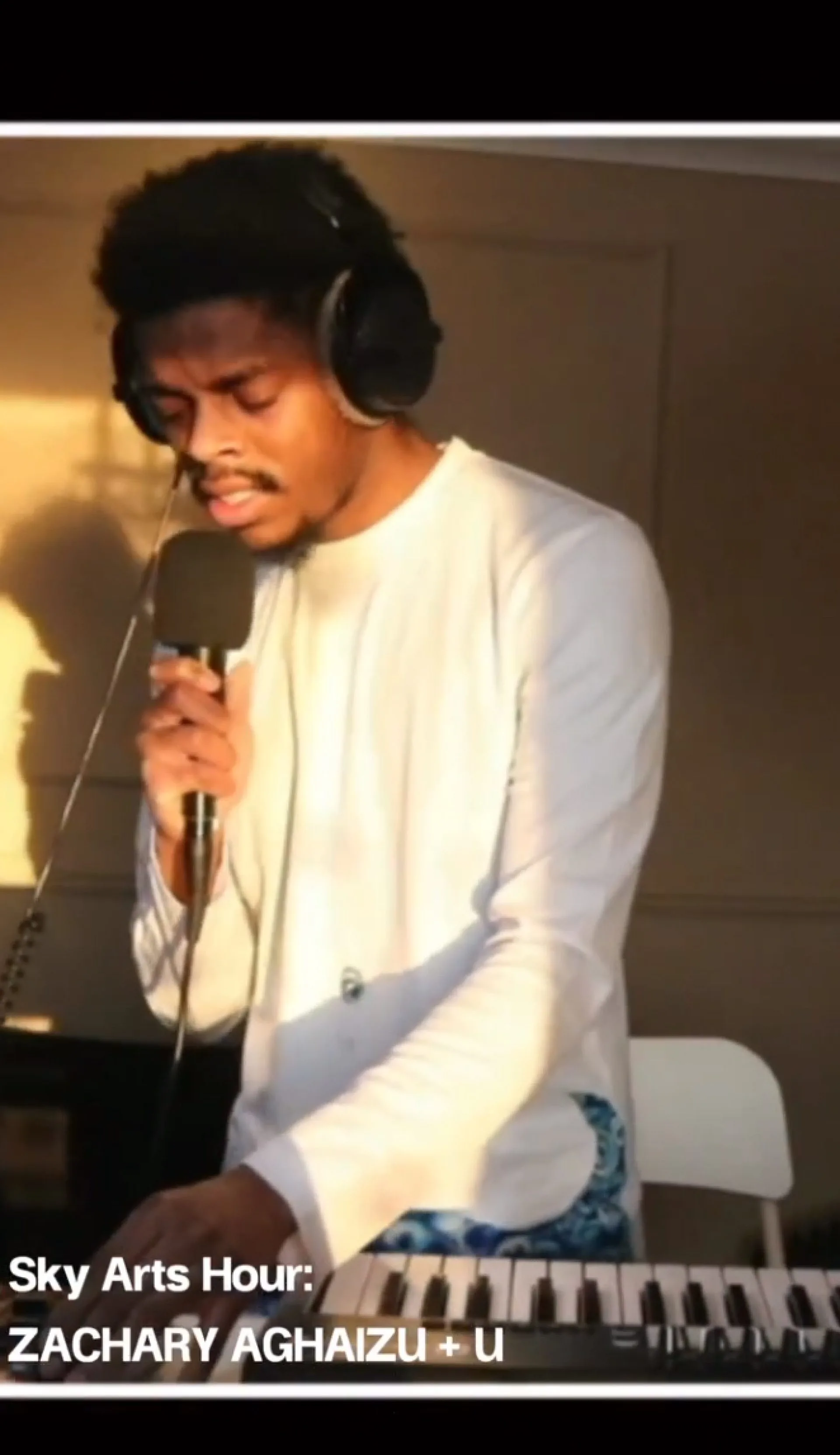 Zachary Aghaizu performing live on keyboard during the Creative UK livestream on the Floating Harbour boat
