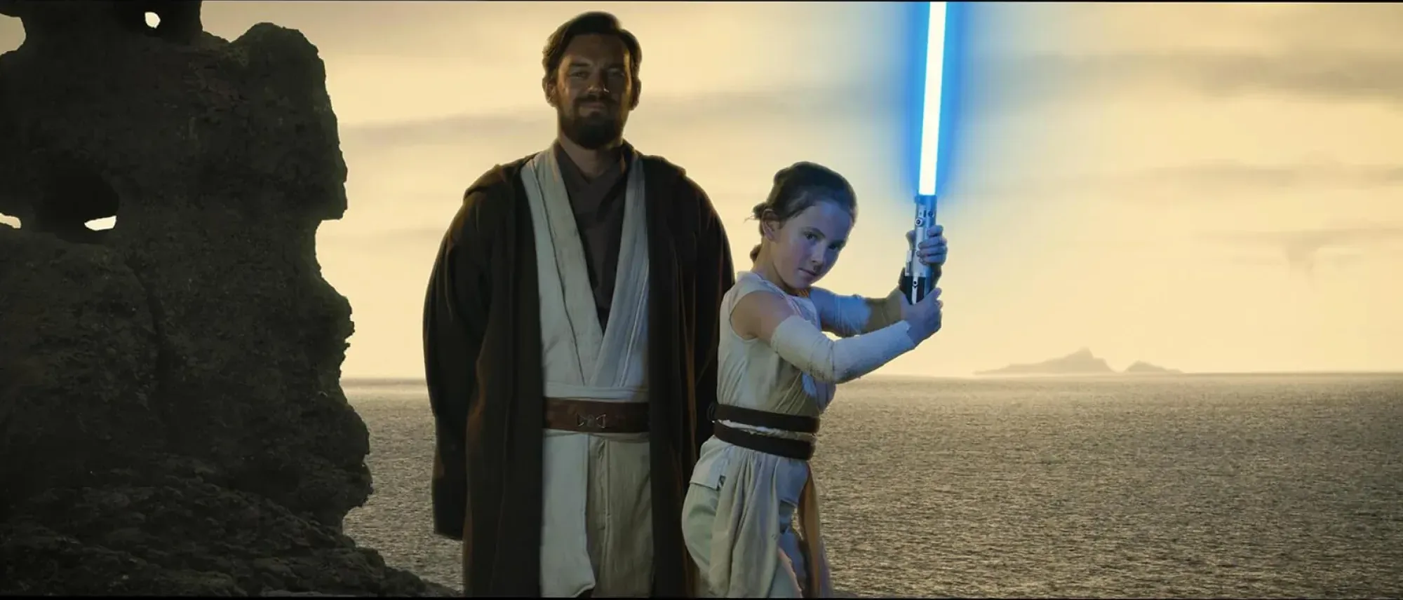 Star Wars stlye dad and daughter with light saber