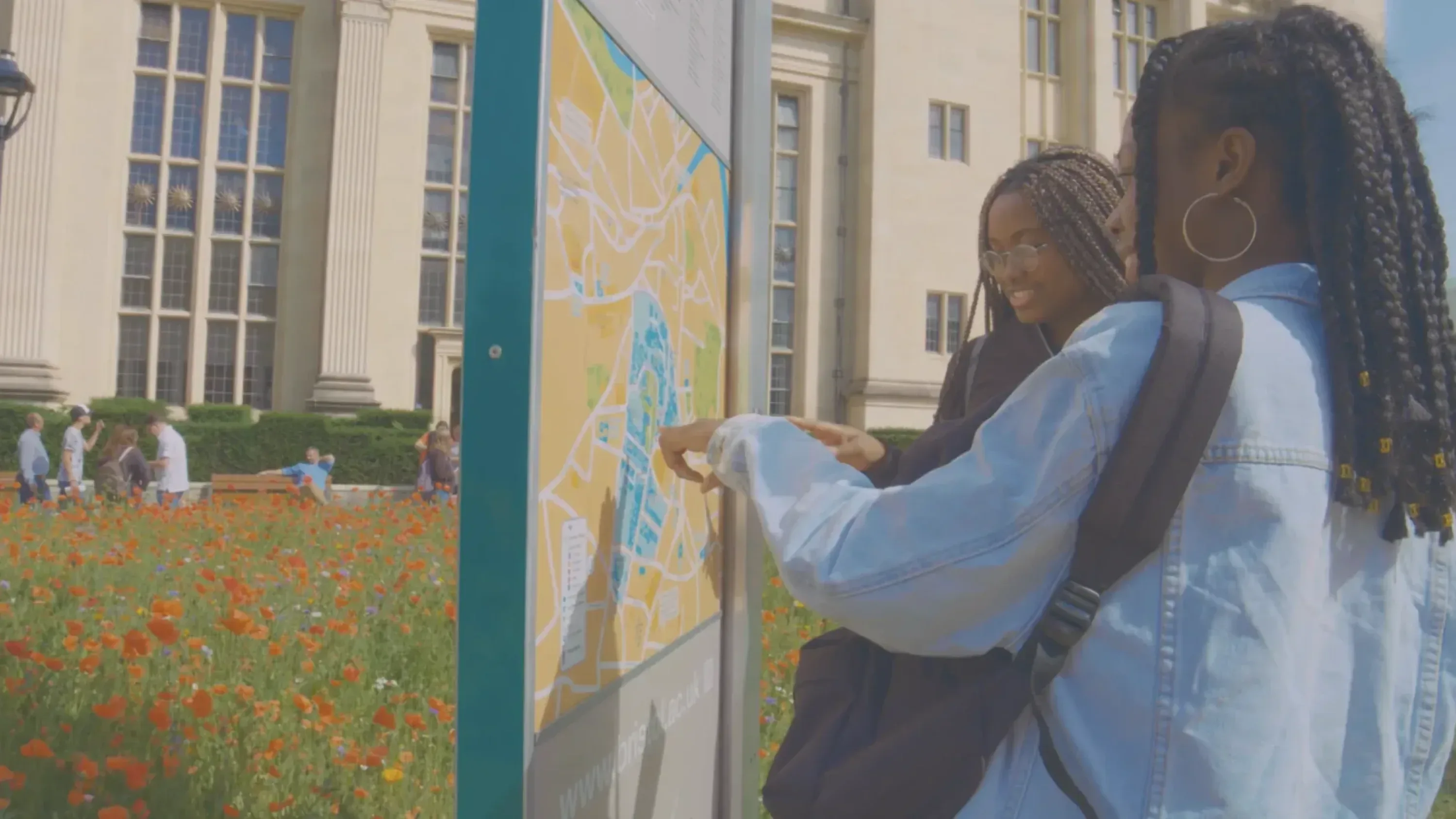 Two students looking at a campus map during a University of Bristol open day, filmed by Floating Harbour